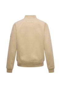 Sweatshirt crème à col rond avec un col et un ourlet côtelés, présentant une étiquette de logo à l'arrière et des poignets côtelés. Texture de tissu lisse.