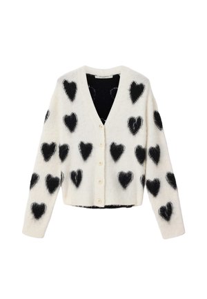 Hvit cardigan med svarte, lodne hjerte-mønstre, V-hals, knappelåsing og lange ermer. Myk tekstur med cropped design.