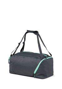 Schwarze Reisetasche mit türkisfarbenen Reißverschlüssen, hergestellt aus strapazierfähigem Material, mit zwei Griffen und einem geräumigen Hauptfach. Rechteckige Form, minimalistisches Design.