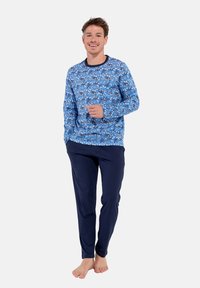 Blaues Schlafanzugset mit einem gemusterten Langarmoberteil im floralen Design und einer marineblauen Hose. Weicher Stoff, lockere Passform.