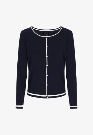 Tumes sinine ribatud kardigan valgete detailidega, ümar kaelus ja pikad varrukad. Omab nööbiga eesmist avatust ning kontrastset hemmi ja varrukaid.