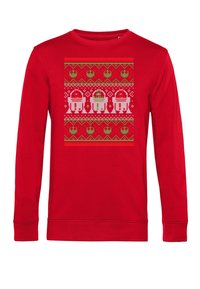 Czerwony sweter z długim rękawem w stylu pixelowym z bożonarodzeniowym wzorem przedstawiającym trzy droidy z Gwiezdnych Wojen oraz zielone wzory tematyczne związane ze świętami.
