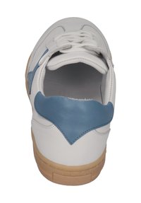 White leather sneaker with blue accent near the heel, textured sole, and white laces. Smooth finish with rounded shape, minimal design.
