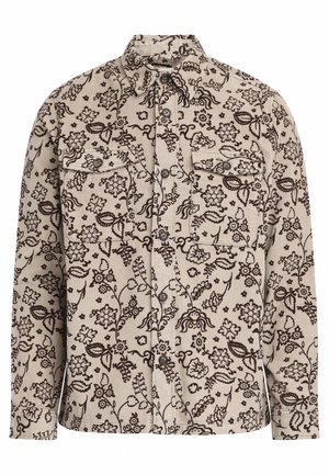 Vaaleanbeige corduroy-paita, jossa on tummia kukkakuoseja, kaksi rintataskua, nepparipainikkeet ja klassinen kaulus. Pitkät hihat napillisilla suurilla hihansuilla.