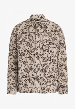 Beige kordbársony ing sötét virágmintával, két mellzsebbel, pattintós gombokkal és klasszikus gallérral. Hosszú ujjak gombos mandzsettával.