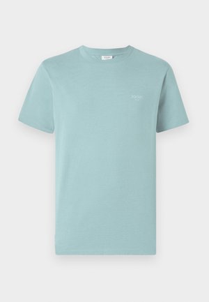 Light blue cotton t-shirt with a crew neck and short sleeves. Features a small brand logo printed in white on the chest. Plain design.