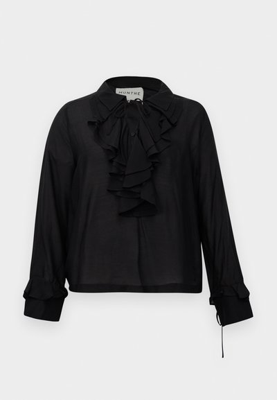 Black long-sleeve blouse with ruffled front, tie neckline, and ruffled cuffs, displayed against a white background.
