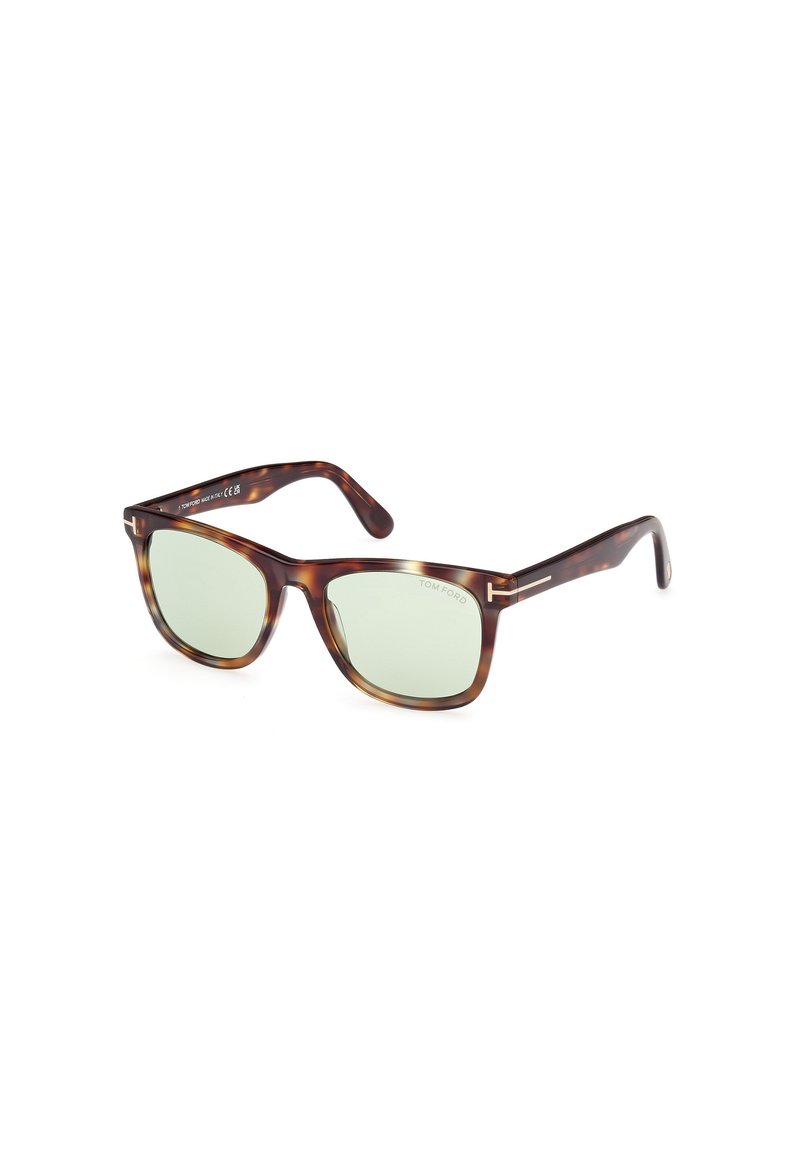 Ochelari de soare din fâșie de țestoasă cu lentile verzi, formă rectangulară, temple elegante și accente argintii pe balamale. Numele brandului imprimat pe interior.