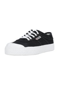 Sneakers neri in canvas con suola in gomma bianca textura, lacci bianchi e punta arrotondata con cappuccio bianco a contrasto.