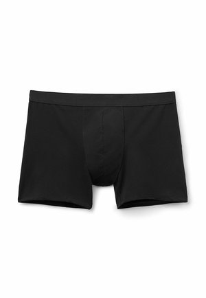 Boxer shorts de algodón negro con un diseño ajustado, cinturilla elástica y bolsa frontal para soporte. Textura suave sin patrones visibles.