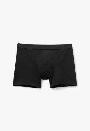 Sorte bomuldsboxershorts med et tætsiddende design, elastisk talje og frontlomme for støtte. Glat tekstur uden synlige mønstre.