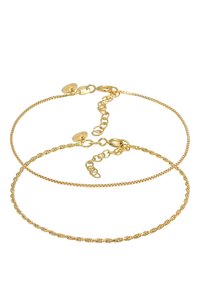 Guldtonade fotlänkar med en slät kedja och en vriden design. Justerbara längder med kräftkläppar och länkar för säker fästning.