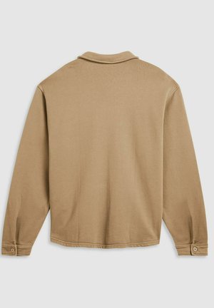 Langärmeliges Hemd mit Kragen in Hellbraun, aus weichem Baumwollmischgewebe, mit geknöpften Manschetten und minimalen Nahtdetails.