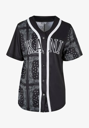 Fekete, rövid ujjú póló bandana mintával, fehér kiegészítőkkel és kontrasztos fekete gombokkal. Az elején a "KANI" felirat található.