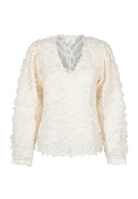Blusa a maniche lunghe di colore crema con scollatura a V e delicati dettagli a frange sul tessuto e sulle maniche.