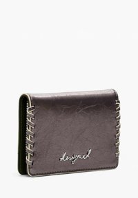 Brown leather wallet with a textured surface, featuring decorative stitching along the side and a silver logo on the front. Compact design.