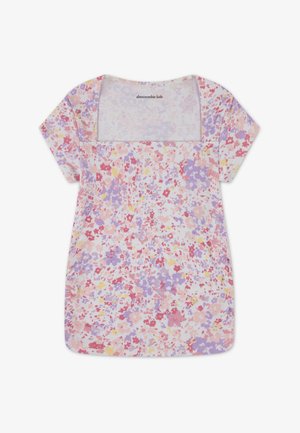 Top de manga corta con estampado floral en colores pastel, que presenta un escote cuadrado. El material tiene una textura acanalada con flores dispersas en tonos rosa, púrpura y amarillo.