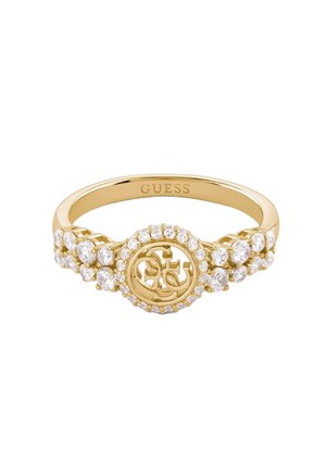 Bague en or avec un centre circulaire présentant des lettres entrelacées, entourée de petits pierres précieuses claires le long des bords de la bande.