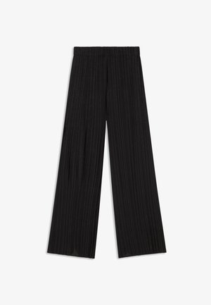 Zwarte wijde broek gemaakt van geplooide stof, met een elastische tailleband en een gladde, strakke textuur.