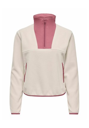 Pull en polaire crème à manches longues, col montant zippé rose, bordures de poche roses et détails roses à l’ourlet et aux poignets.