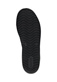 Semelle de chaussure en caoutchouc noir avec un motif texturé en vagues, présentant une forme arrondie et des détails de marque en relief au centre et près de l'orteil.