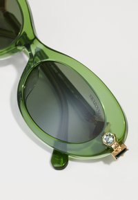 Swarovski Päikeseprillid - transparent green