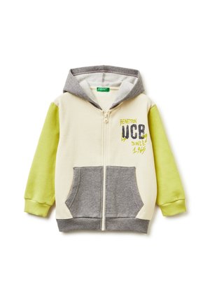 Hoodie zippé coloré avec une capuche grise, un devant crème et des manches vert lime. Doté d'une poche kangourou et d'un détail graphique "Benetton UCB".