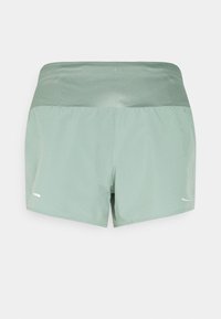 Light green athletic shorts with a wide, textured waistband. Features a reflective logo on the left side and a smooth, lightweight fabric.