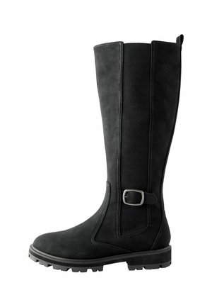 Botas negras hasta la rodilla hechas de suave ante, con paneles laterales elásticos, un acento de hebilla de metal y una suela de goma resistente. Diseño de tacón plano.
