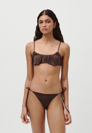 Brown bikini set with ruffled bralette top and adjustable tie-side bottom. Smooth material with minimal hardware details.