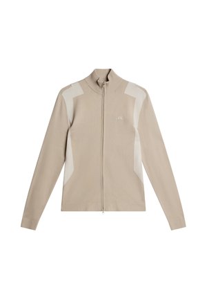 Pull beige à fermeture éclair en tissu doux, avec un col montant, des manches longues et des panneaux d'accent contrastants blanc cassé aux épaules.
