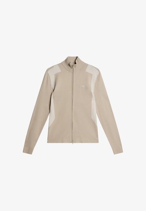 Maglione beige con cerniera in tessuto morbido, caratterizzato da un colletto alto, maniche lunghe e pannelli accentuati di colore bianco sporco sulle spalle.