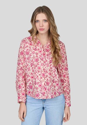 Blouse à manches longues en tissu rose clair avec un imprimé floral dans des nuances de rose. Col à boutonnière et coupe décontractée.