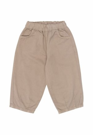 Pantalones beige holgados para niños pequeños con cinturilla elástica, bolsillos delanteros y puños elásticos en los tobillos.