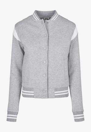 Gray sweatshirt jacket with a button-up front, white sleeve accents, and striped ribbed cuffs and hem. Made of soft fabric.