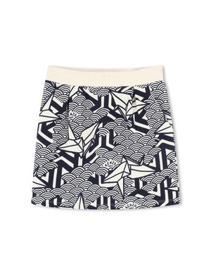 Navy and cream skirt featuring a geometric design with waves and origami shapes. Made from a woven fabric with a textured finish.
