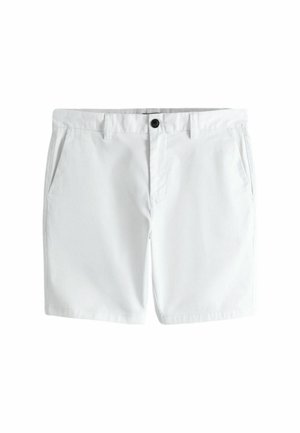 Weiße Baumwollshorts mit seitlichen Taschen, Gürtelschlaufen und einem schwarzen Knopfverschluss am Bund.