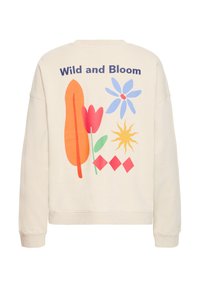 Sweat-shirt crème avec un graphisme coloré au dos, incluant des fleurs, un soleil et des formes abstraites de différentes couleurs.