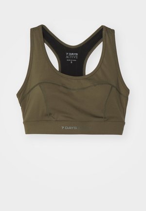 Top sportivo verde oliva con design a corsetto, realizzato in tessuto liscio. Presenta dettagli di cucitura e logo stampato in basso. Taglia: S.