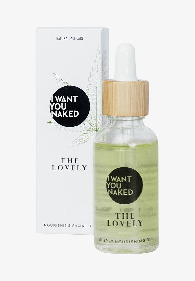 Transparent glasflaska med ett droppkapsyl i bambu, innehållande en ljusgrön ansiktsolja. Förpackningen består av en vit låda med växtgrafik och svart text.