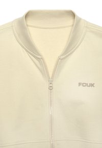 Hellbeige Zip-Jacke mit Reißverschluss und geripptem Kragen sowie FCUK-Logo. Weicher Stoff mit glatter Textur und kontrastierendem Reißverschlussdetail.