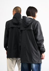 Rains UNISEX - Vandeniui atspari striukė - black