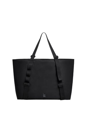 Borsa tote rettangolare nera con due spallacci regolabili e un piccolo logo verticale vicino al centro inferiore.