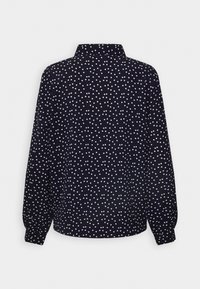 Navy blue blouse with white polka dots, collared, long sleeves with gathered cuffs, smooth fabric. Back view showcases the pattern and design.