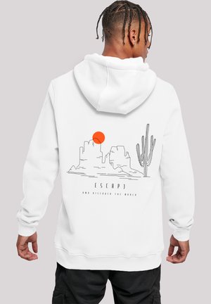 White hoodie featuring a graphic design of mountains, a sun, and a cactus. Text reads “ESCAP3 AND DISCOVER THE WORLD.” Soft fabric with a relaxed fit.