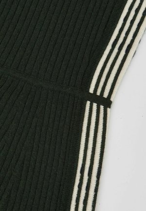 Dark green ribbed fabric with contrasting cream and navy stripes along the sides, featuring a smooth texture and elastic waistband.