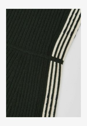 Tamsiai žalia, raštuota medžiaga su kontrastingomis kreminės ir tamsiai mėlynos juostomis palei šonus, pasižymi lygiu tekstūra ir elastinga juosmens juosta.