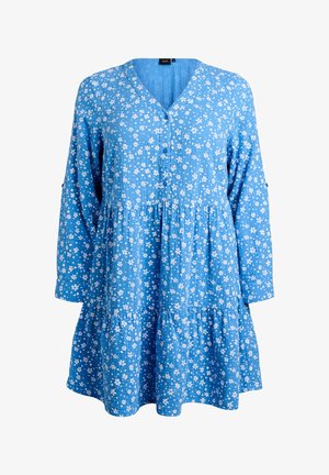 Modra obleka z belim cvetličnim vzorcem, V-izrezom, zapiranjem na gumbe, dolgimi rokavi in slojno robom z volančki. Izdelana iz teksturirane tkanine.