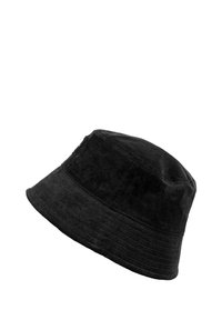 Black corduroy bucket hat with a soft texture, featuring a wide, downward-sloping brim and subtle vertical ridges.