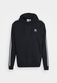 Schwarzer Hoodie aus weichem Stoff, mit einer Fronttasche, einer verstellbaren Kapuze und weißem Drei-Streifen-Design entlang der Ärmel. Adidas-Logo auf der Brust.